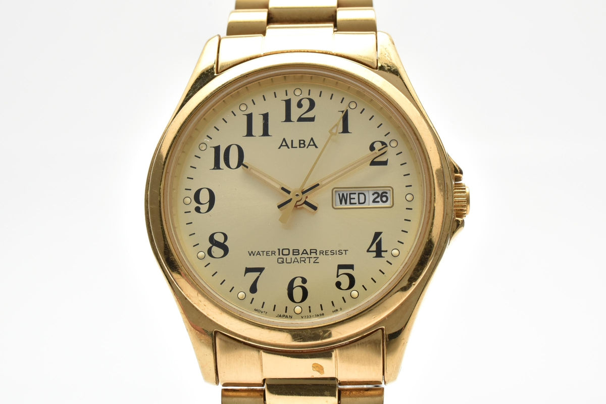 SEIKO セイコー ALBA アルバ V733-7A70 メンズ クォーツ 腕時計 ゴールド文字盤 アラビア数字 デイデイト 3針 ステンレス ブレスレット 33mm 1990年代 ヴィンテージ