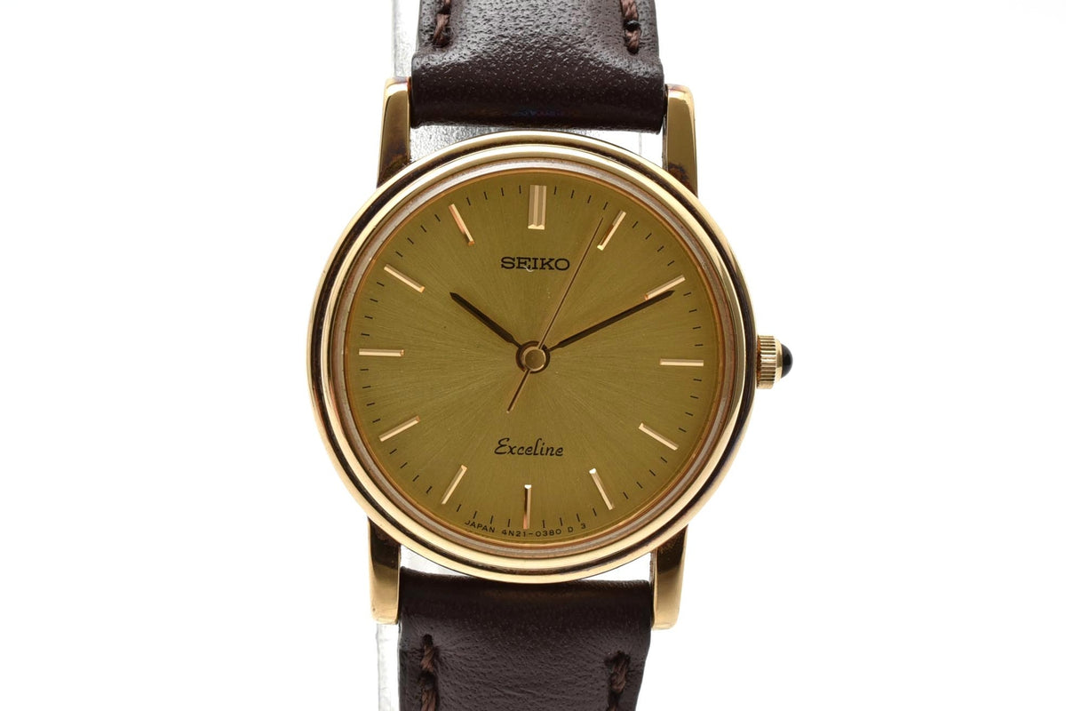 美品 SEIKO セイコー エクセリーヌ 4N21-0180 クォーツ ゴールドカラー シャンパン文字盤 レザーベルト 記念刻印 1990年代 レディース 腕時計 稼働品