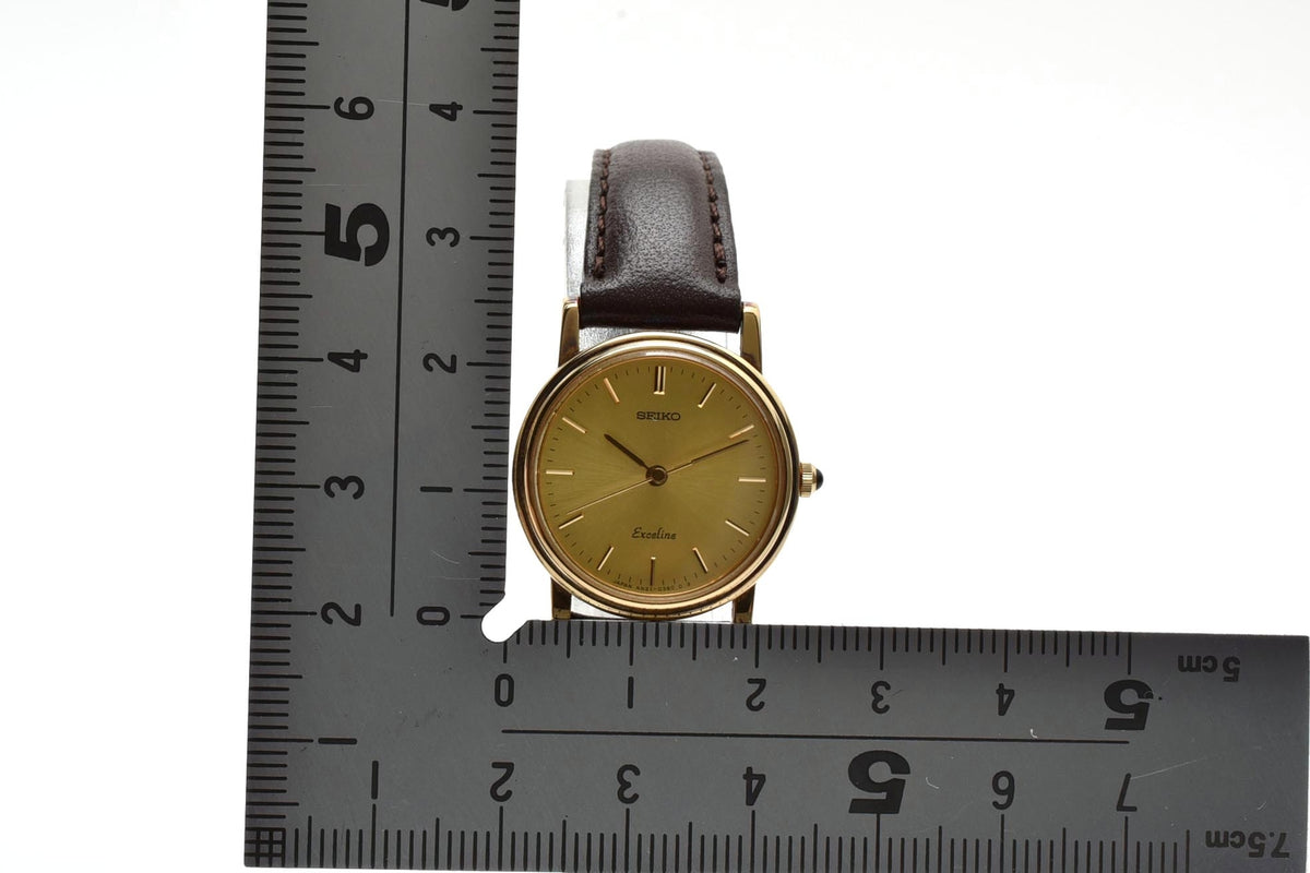 美品 SEIKO セイコー エクセリーヌ 4N21-0180 クォーツ ゴールドカラー シャンパン文字盤 レザーベルト 記念刻印 1990年代 レディース 腕時計 稼働品