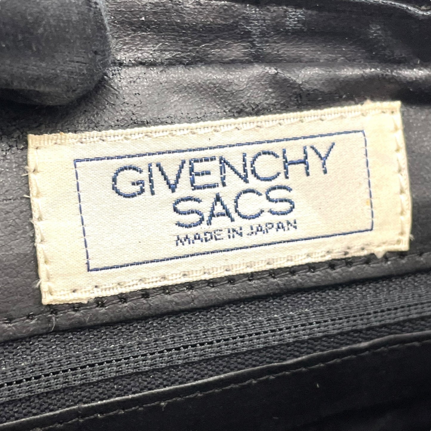 ジバンシィ Givenchy ジバンシー ロゴ金具 クラッチバッグ バイカラー 黒 ブラック 白 ホワイト レザー タッセル フリンジ ヴィンテージ S96