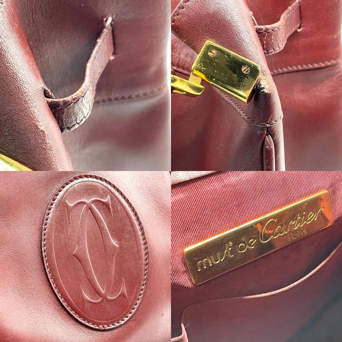 カルティエ マストライン ショルダーバッグ 巾着型 ボルドー ワインレッド レザー ゴールド金具 ロゴ型押し ヴィンテージ レディース A8