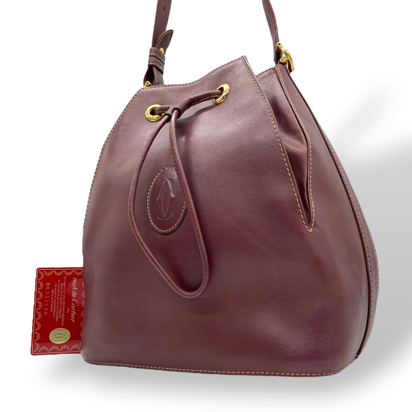 美品 Cartier カルティエ マストライン 巾着型 ショルダーバッグ 赤 ボルドー ワインレッド レザー ゴールド金具 ロゴ 2Cモチーフ 斜め掛け可 レディース ギャランティカード付き K12