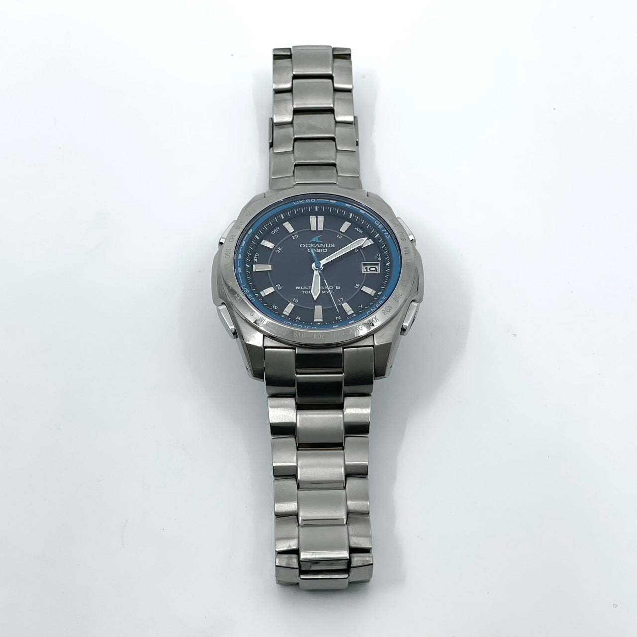 【稼働品／美品】カシオ オシアナス 腕時計 OCW-T100 メンズ 電波ソーラー チタンモデル タフソーラー MULTI BAND 6 アナログ デイト カレンダー シルバー ネイビー文字盤 ブルーベゼル ビジネス 高機能 箱付き クリーニング済み G