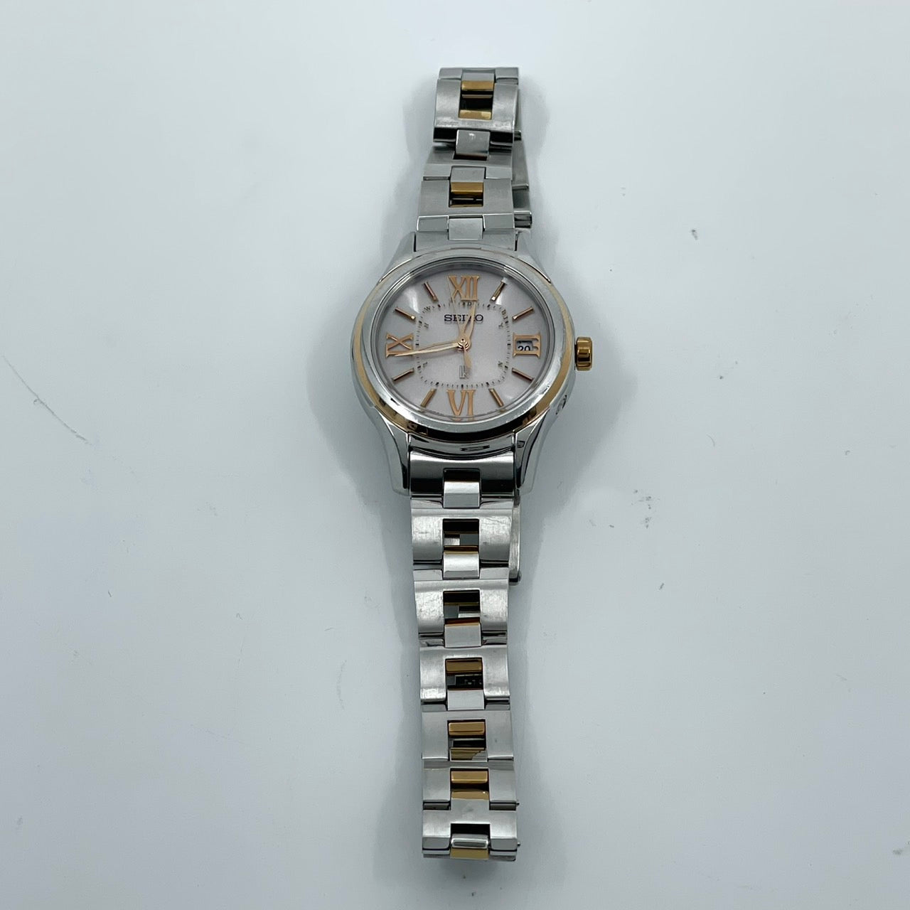 【稼働品／美品】セイコー ルキア 人気モデル 腕時計 1B22-0AS0 電波ソーラー レディース デイト ピンクゴールド コンビカラー ローマ数字 上品 エレガント ビジネス オフィス 高機能 洗練デザイン 手元華やか クリーニング済 G5