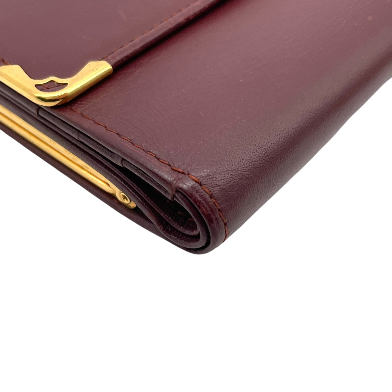 Cartier カルティエ コインケース 小銭入れ 財布 ウォレット コンパクト マストライン レザー 本革 ボルドー ワインレッド 赤茶色 ゴールド金具 ヴィンテージ ビンテージ エレガント クラシック 上品 デイリー 男女兼用 小物 M4