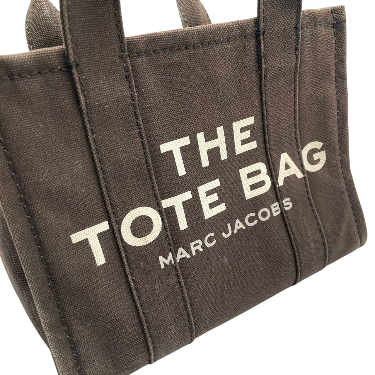 マークジェイコブス MARC JACOBS ザ トートバッグ THE TOTE BAG キャンバス ブラウン ブラック 茶 黒 2WAY ショルダー バッグ ハンドバッグ 斜め掛け可 クロスボディ 自立可 レディース カジュアル ロゴ デザイン S75