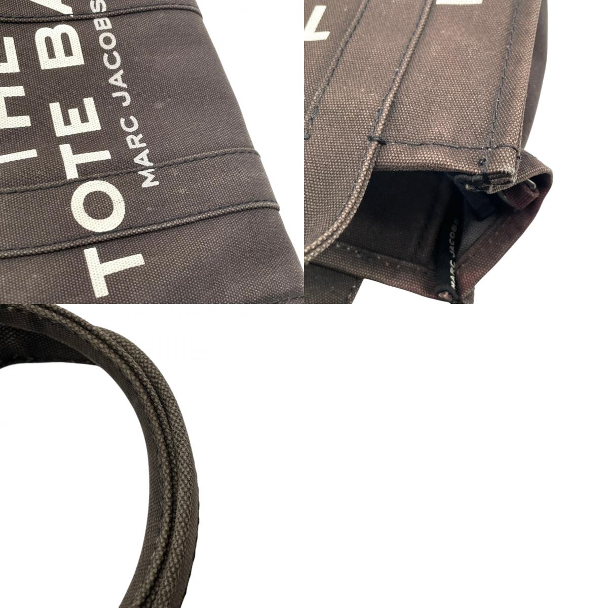 マークジェイコブス MARC JACOBS ザ トートバッグ THE TOTE BAG キャンバス ブラウン ブラック 茶 黒 2WAY ショルダー バッグ ハンドバッグ 斜め掛け可 クロスボディ 自立可 レディース カジュアル ロゴ デザイン S75