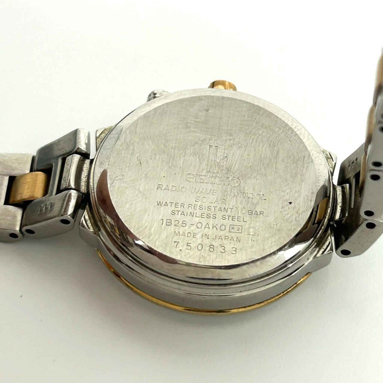 【稼働品】SEIKO LUKIA セイコー ルキア レディース腕時計 ソーラー電波 1B25-0AK0 ワールドタイム デイト ピンク文字盤 シルバー ゴールド コンビカラー エレガント ビジネス クラシックデザイン クリーニング済み G6