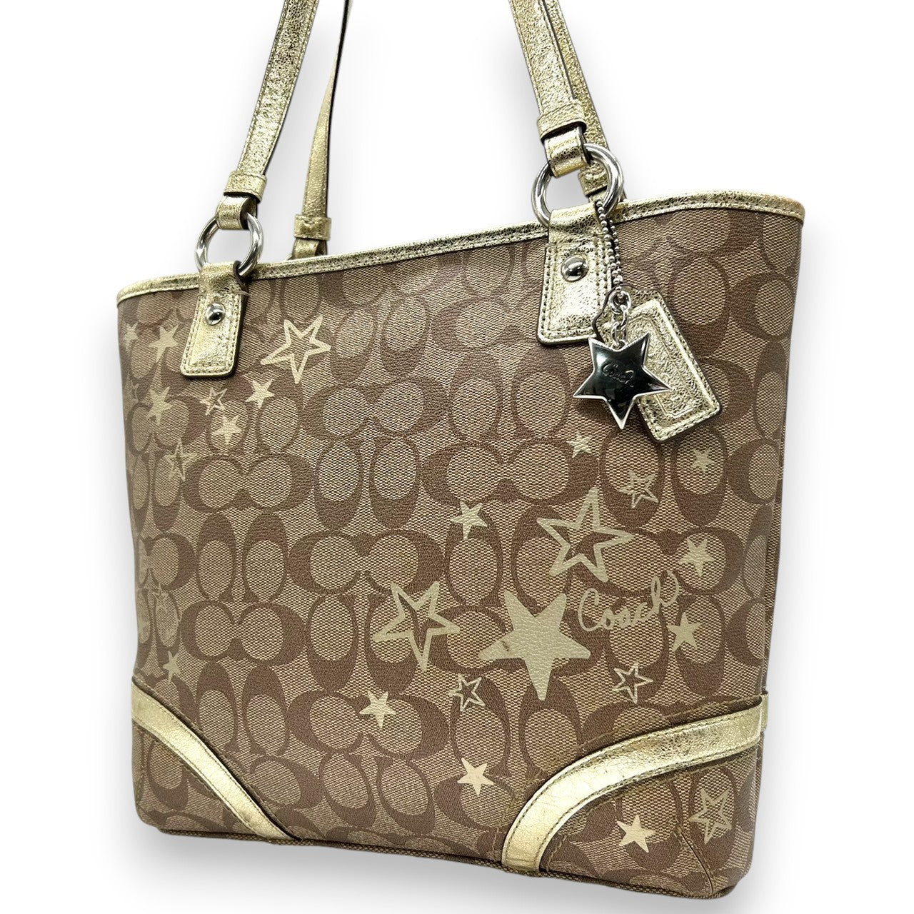 【未使用級】 COACH コーチ トートバッグ F18853 シグネチャー スター 星柄 PVC レザー ブラウン ゴールド レディース A4収納可 肩掛け チャーム付 通勤 通学 エレガント キュート 大容量 s49