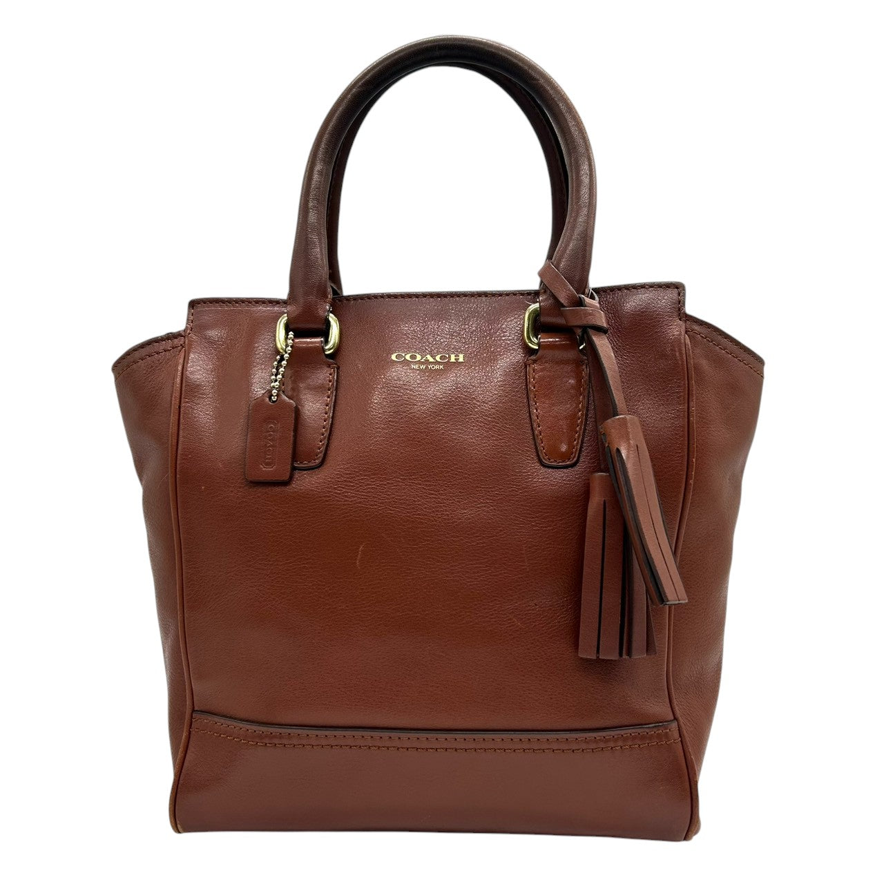 コーチ 2WAY トートバッグ ハンドバッグ ショルダーバッグ レザー 本革 ブラウン 斜め掛け可 タッセルチャーム付き レディース ミニトート コンパクト 通勤 カジュアル エレガント ロゴプレート 上質レザー 自立可 クリーニング済み s53