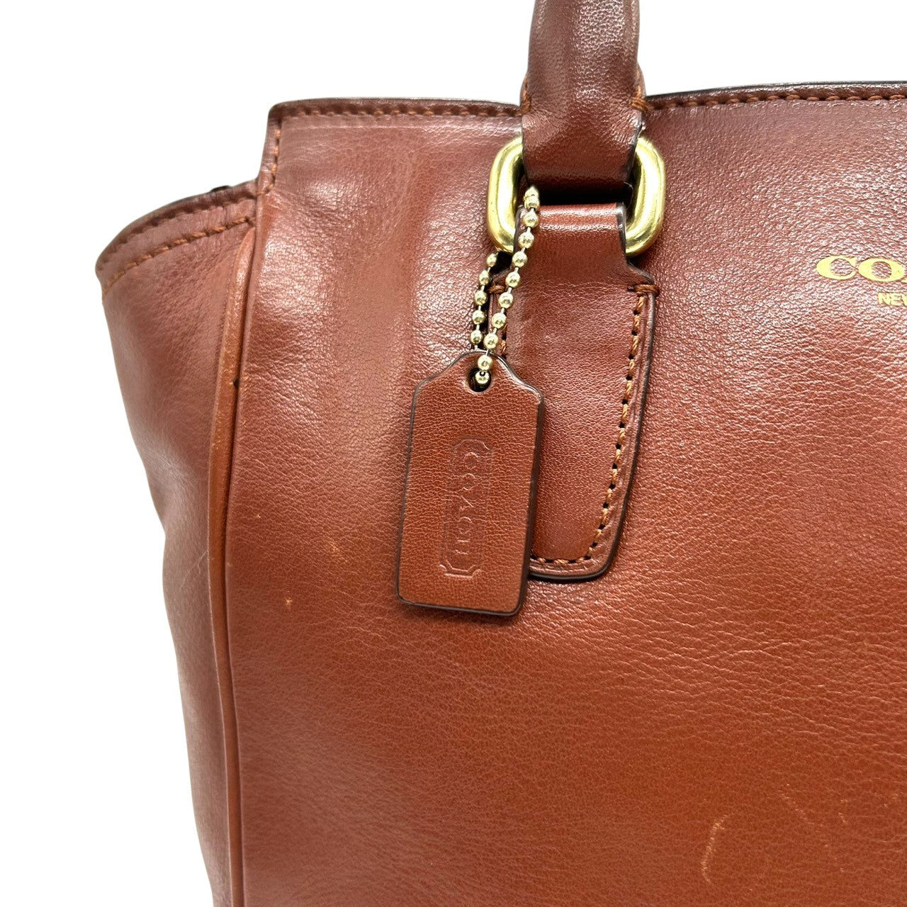 コーチ 2WAY トートバッグ ハンドバッグ ショルダーバッグ レザー 本革 ブラウン 斜め掛け可 タッセルチャーム付き レディース ミニトート コンパクト 通勤 カジュアル エレガント ロゴプレート 上質レザー 自立可 クリーニング済み s53