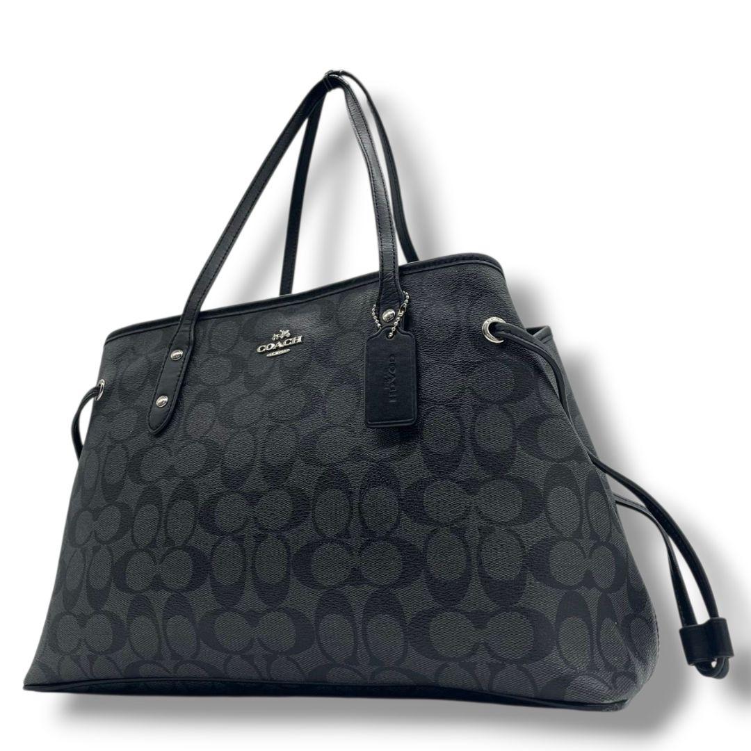 コーチ　トートバッグ　ブラック　シグネチャー　巾着　ワンショルダー　PVC　ハンドバッグ　肩掛け可　肩かけ可　ロゴタグ　シルバー金具　ロゴ　COACH　F57842　オシャレ　本物保証　鑑定済　スピード発送