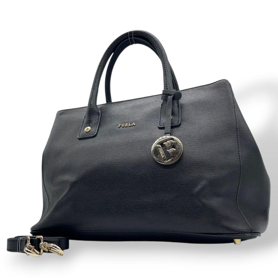 フルラ トートバッグ ブラック 2way レザー ショルダーバッグ ハンドバッグ 本革 ロゴチャーム ロゴプレート ゴールド金具 FURLA