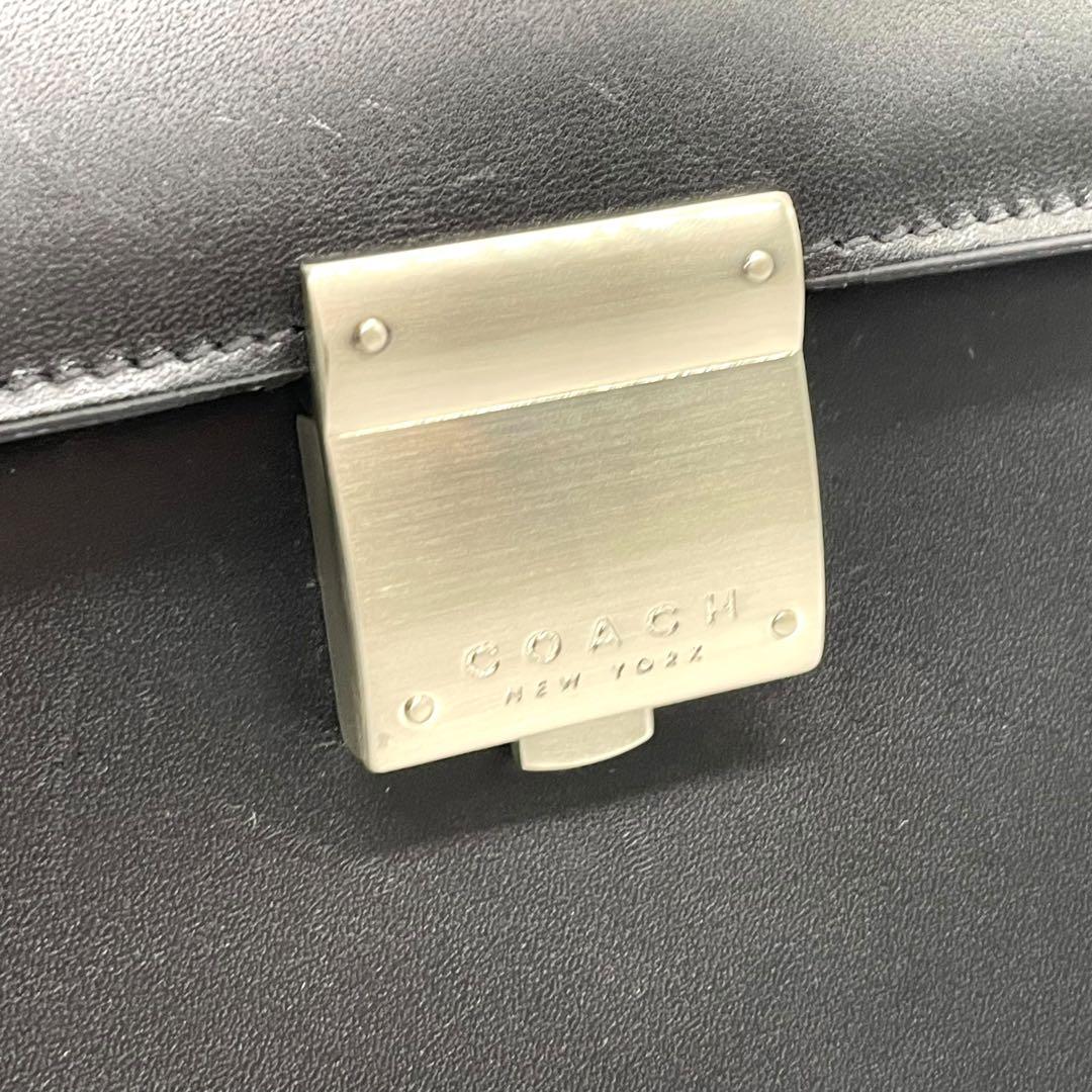 コーチ ビジネスバッグ レザー ブラック A4収納 ブリーフケース フラップ ハンドバッグ トートバッグ 大容量 シルバー金具 チャーム付き COACH E