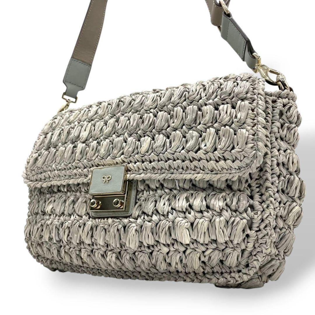 アニヤハインドマーチ ANYA HINDMARCH ショルダーバッグ グレージュ 灰 カゴ 編み込み リボン フラップ 斜め掛け可 自立可 ゴールド金具 ターンロック s81