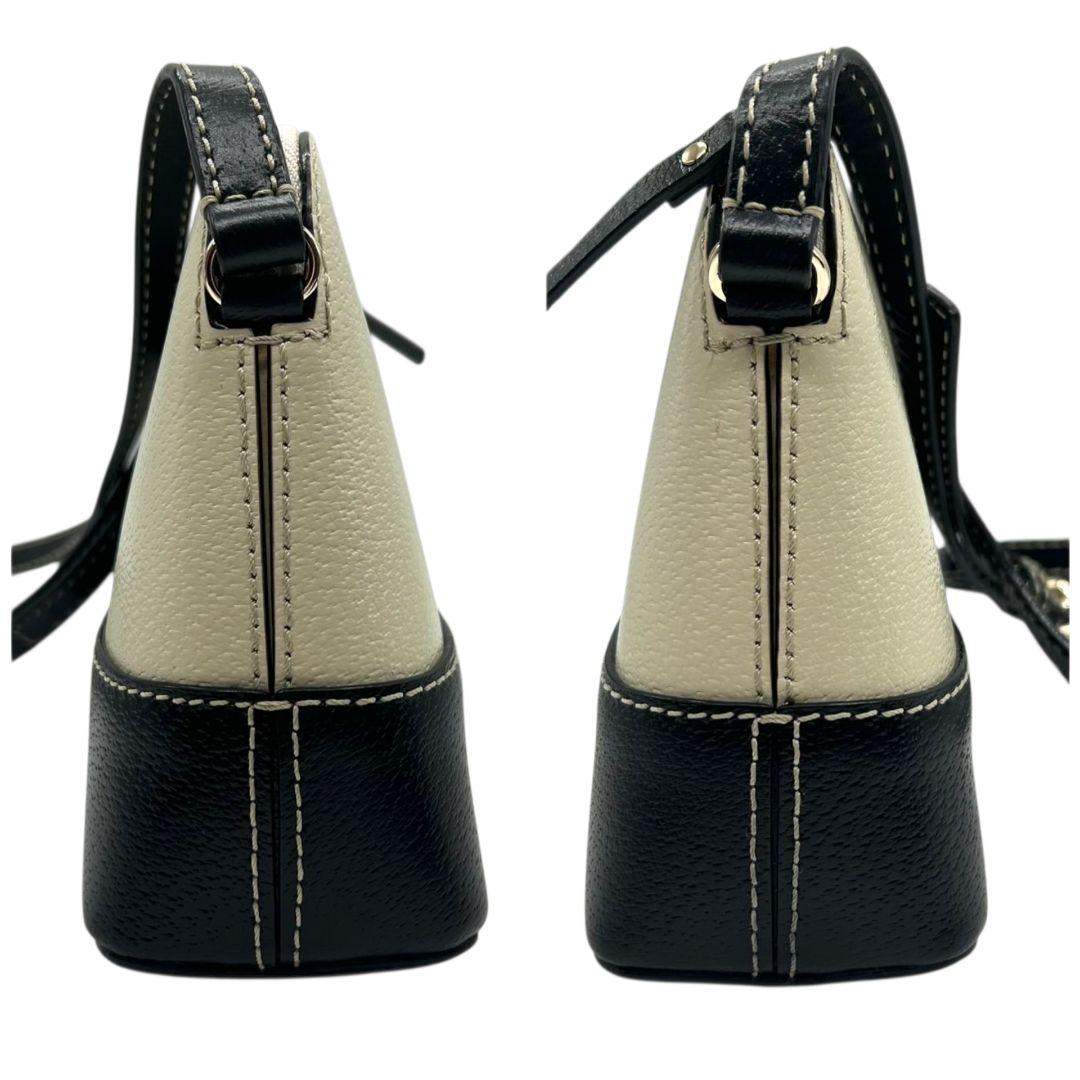 ケイトスペード ショルダーバッグ 黒 白 バイカラー ドーム型 斜め掛け可 自立可 PVC ロゴプレート シルバー金具 ブラック ホワイト kate spade 上品 おしゃれ 通勤 通学