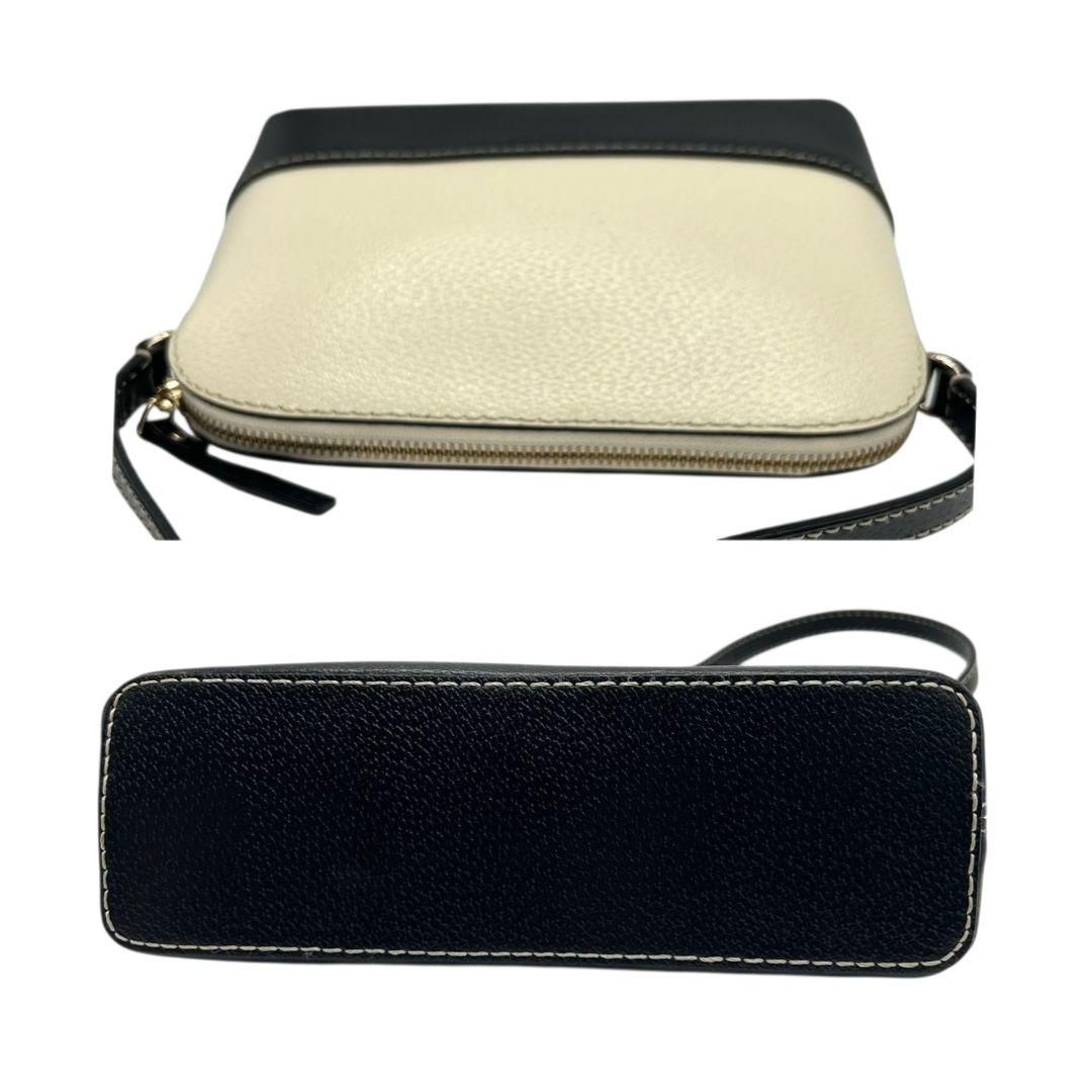 ケイトスペード ショルダーバッグ 黒 白 バイカラー ドーム型 斜め掛け可 自立可 PVC ロゴプレート シルバー金具 ブラック ホワイト kate spade 上品 おしゃれ 通勤 通学