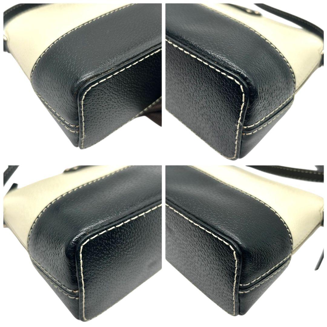 ケイトスペード ショルダーバッグ 黒 白 バイカラー ドーム型 斜め掛け可 自立可 PVC ロゴプレート シルバー金具 ブラック ホワイト kate spade 上品 おしゃれ 通勤 通学