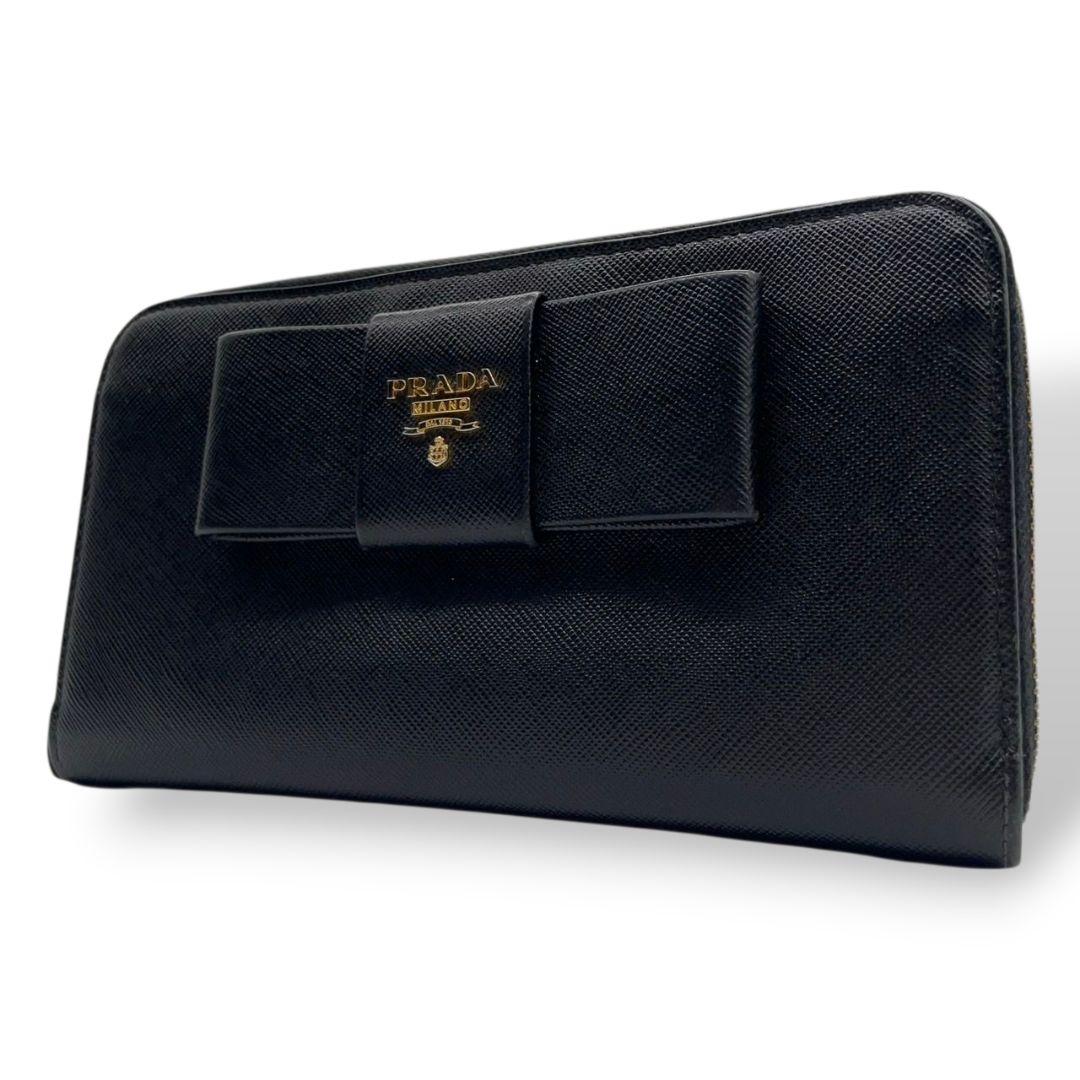 美品 プラダ 長財布 ブラック 黒 リボン サフィアーノ レザー 本革 ラウンドファスナー ラウンドジップ ゴールド金具 ロゴ PRADA W1